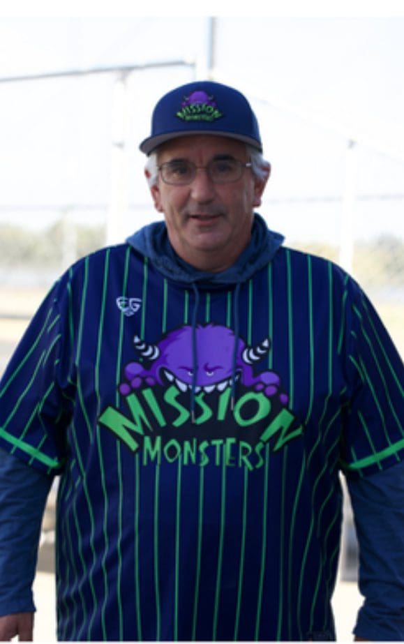 Man wearing a baseball jersey with a purple monster and 'Mission Monsters' text.
